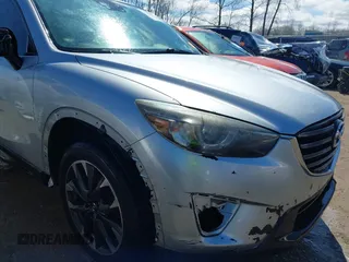 2016 Mazda CX-5 Grand Touring with VIN JM3KE4DY9G0795360, listed as a IAAI auction lot 41933991 with 176,373 mi miles. Bid and sale history available at carsss.com. Image 6.