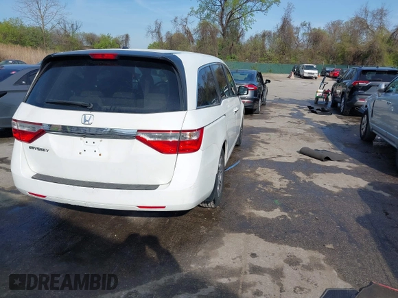 2011 Honda Odyssey EX-L with VIN 5FNRL5H6XBB059162, listed as a IAAI auction lot 42061378 with 164,317 mi miles and . Bid and sale history available at carsss.com. Image 4.