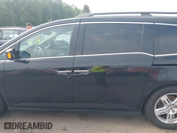 2011 Honda Odyssey Touring with VIN 5FNRL5H93BB104906, listed as a IAAI auction lot 42371279 with 183,856 mi miles and . Bid and sale history available at DreamBid. Image 14.