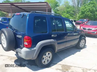 2004 Jeep Liberty Sport with VIN 1J4GK48KX4W241129, listed as a IAAI auction lot 41980258 with 259,048 mi miles and . Bid and sale history available at DreamBid. Image 4.