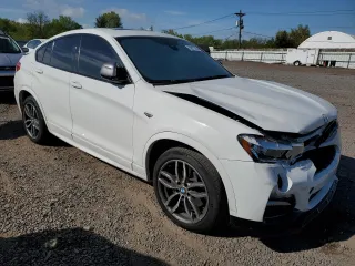 2018 BMW X4 M40i with VIN 5UXXW7C52J0W64443, listed as a Copart auction lot 53877525 with 49,634 mi miles and Salvage title. Bid and sale history available at DreamBid. Image 4.