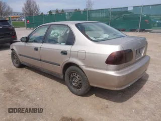 2000 Honda Civic LX with VIN 1HGEJ6670YL030749, listed as a IAAI auction lot 42112694 with 153,903 mi miles. Bid and sale history available at carsss.com. Image 3.