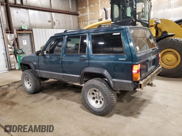 1996 Jeep Cherokee Sport with VIN 1J4FJ68S1TL226495, listed as a Copart auction lot 58587685 with 205,397 mi miles and Salvage title. Bid and sale history available at DreamBid. Image 2.