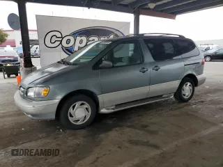 2000 Toyota Sienna LE with VIN 4T3ZF13C8YU219295, listed as a Copart auction lot 60460005 with 76,613 mi miles and Salvage title. Bid and sale history available at DreamBid. Image 1.