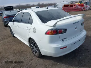 2015 Mitsubishi Lancer SE with VIN JA32V2FW9FU025402, listed as a IAAI auction lot 41646407 with 67,201 mi miles. Bid and sale history available at carsss.com. Image 3.