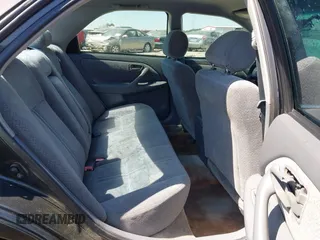 2000 Toyota Camry CE z VIN 4T1BG22K5YU989265, wystawiony jako IAAI lot #41800338 z przebiegiem 381 964 mil mil oraz . Historia ofert i sprzedaży dostępna na DreamBid. Obrazek 8.