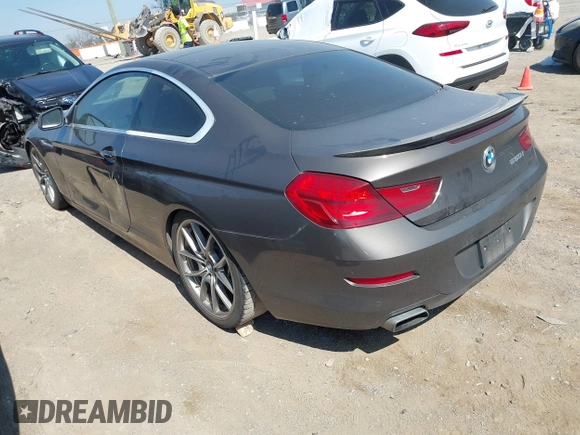 2012 BMW 6 Series 650i z VIN WBALX3C57CC528832, wystawiony jako IAAI lot #41779268 z przebiegiem 75 119 mil mil oraz . Historia ofert i sprzedaży dostępna na DreamBid. Obrazek 3.