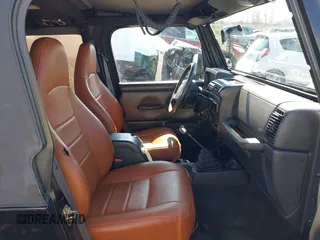 2002 Jeep Wrangler X with VIN 1J4FA39S52P770664, listed as a IAAI auction lot 41661580 with 122,445 mi miles. Bid and sale history available at carsss.com. Image 5.