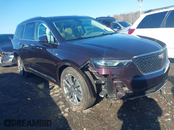2021 Cadillac XT6 Premium Luxury with VIN 1GYKPDRS7MZ133561, listed as a IAAI auction lot 41112365 with 73,956 mi miles. Bid and sale history available at carsss.com. Image 1.