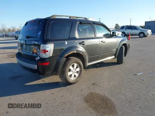 2008 Mercury Mariner with VIN 4M2CU81168KJ26462, listed as a IAAI auction lot 41454643 with 214,873 mi miles and . Bid and sale history available at DreamBid. Image 4.