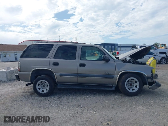 2002 Chevrolet Tahoe LS z VIN 1GNEC13Z72R258244, wystawiony jako IAAI lot #42639069 z przebiegiem Nie podano mil oraz . Historia ofert i sprzedaży dostępna na DreamBid. Obrazek 13.