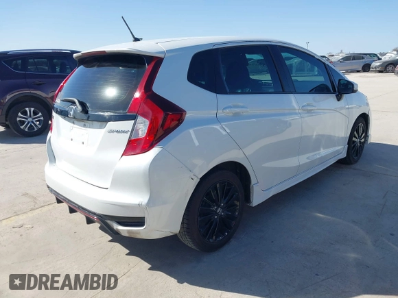 2018 Honda Fit Sport z VIN 3HGGK5H62JM732645, wystawiony jako IAAI lot #41216302 z przebiegiem 107 128 mil mil oraz . Historia ofert i sprzedaży dostępna na DreamBid. Obrazek 4.