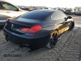 2017 BMW M6 z VIN WBS6J9C3XHD934858, wystawiony jako Copart lot #73714104 z przebiegiem Nie podano mil oraz Szkoda całkowita • Salvage title. Historia ofert i sprzedaży dostępna na DreamBid. Obrazek 3.