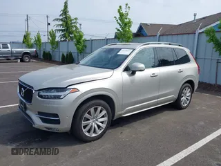 2016 Volvo XC90 T6 Momentum with VIN YV4A22PK7G1038750, listed as a IAAI auction lot 42128057 with 124,112 mi miles. Bid and sale history available at carsss.com. Image 2.