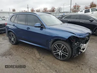 2020 BMW X5 M50i with VIN 5UXJU4C07LLE46002, listed as a Copart auction lot 77853984 with 74,098 mi miles and Salvage Title. Bid and sale history available at DreamBid. Image 4.