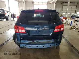 2013 Dodge Journey American Value with VIN 3C4PDCAB4DT581984, listed as a Copart auction lot 59953515 with 166,927 mi miles and Salvage title. Bid and sale history available at DreamBid. Image 6.