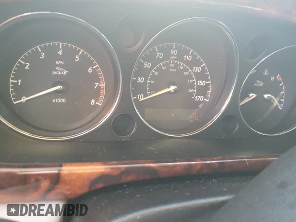 2004 Jaguar XJ with VIN SAJEA74C24SG09038, listed as a Copart auction lot 77015544 with Not Provided miles and Salvage Title. Bid and sale history available at DreamBid. Image 9.