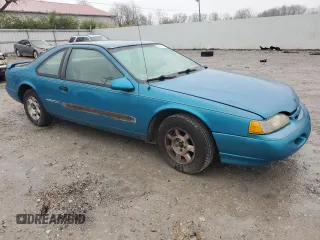 1994 Ford Thunderbird LX with VIN 1FALP6243RH223519, listed as a Copart auction lot 80962814 with 125,016 mi miles and Salvage Title. Bid and sale history available at DreamBid. Image 4.