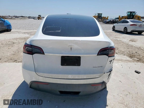 2023 Tesla Model Y Long Range z VIN 7SAYGDEE1PA155629, wystawiony jako Copart lot #52234735 z przebiegiem 24 944 mil mil oraz Szkoda całkowita • Salvage title. Historia ofert i sprzedaży dostępna na DreamBid. Obrazek 6.