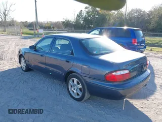 2002 Mazda 626 LX with VIN 1YVGF22D925287959, listed as a IAAI auction lot 41610932 with 122,333 mi miles. Bid and sale history available at carsss.com. Image 3.