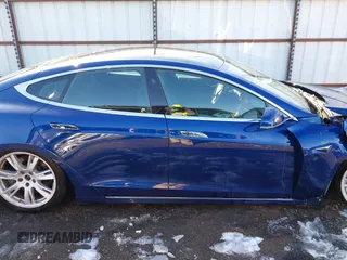 2020 Tesla Model S Long Range with VIN 5YJSA1E26LF410779, listed as a IAAI auction lot 41241192 with 68,764 mi miles and . Bid and sale history available at DreamBid. Image 14.