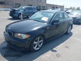 2011 BMW 1 Series 128i with VIN WBAUP9C51BVL90277, listed as a IAAI auction lot 42572690 with 153,427 mi miles and . Bid and sale history available at DreamBid. Image 2.
