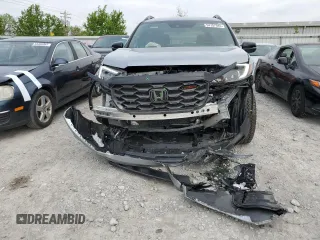2024 Honda Passport TrailSport z VIN 5FNYF8H65RB001572, wystawiony jako Copart lot #54757945 z przebiegiem 18 872 mil mil oraz Szkoda całkowita • Salvage title. Historia ofert i sprzedaży dostępna na DreamBid. Obrazek 5.