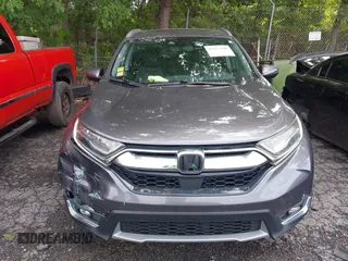 2018 Honda CR-V Touring z VIN 7FARW1H9XJE040530, wystawiony jako IAAI lot #42227446 z przebiegiem 101 299 mil mil oraz . Historia ofert i sprzedaży dostępna na DreamBid. Obrazek 12.