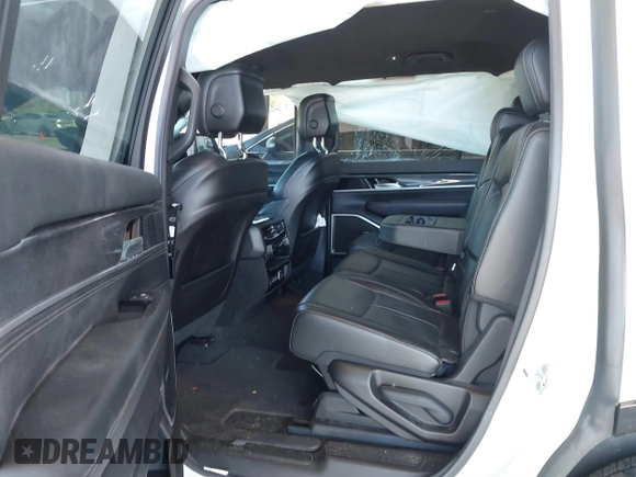2023 Jeep Grand Wagoneer with VIN 1C4SJUAT5PS509425, listed as a IAAI auction lot 41765704 with 65,656 mi miles and . Bid and sale history available at DreamBid. Image 8.