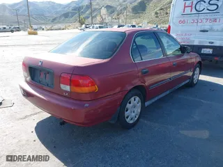 1998 Honda Civic LX with VIN 1HGEJ6671WL032443, listed as a IAAI auction lot 42086174 with 154,881 mi miles. Bid and sale history available at carsss.com. Image 4.