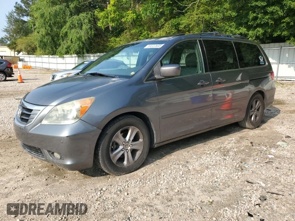2010 Honda Odyssey Touring с VIN 5FNRL3H93AB087771, выставлен на аукционе Copart как лот 59322835 с пробегом 247 000 миль миль и Чистый • Clean title. История ставок и продаж доступна на DreamBid. Изображение 1.