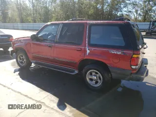 1997 Ford Explorer XL with VIN 1FMDU32E8VZC21604, listed as a Copart auction lot 81987654 with 156,141 mi miles and Salvage title. Bid and sale history available at DreamBid. Image 2.
