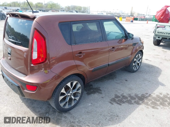 2012 Kia Soul + with VIN KNDJT2A63C7422074, listed as a IAAI auction lot 41911029 with 112,125 mi miles. Bid and sale history available at carsss.com. Image 4.