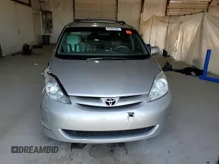 2010 Toyota Sienna XLE with VIN 5TDYK4CCXAS323450, listed as a Copart auction lot 62491545 with 220,121 mi miles and Salvage title. Bid and sale history available at DreamBid. Image 14.