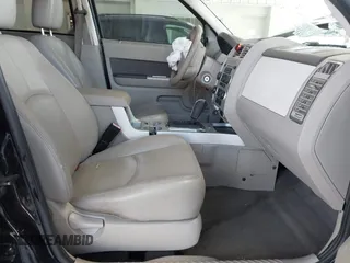 2009 Mercury Mariner Premier z VIN 4M2CU87G09KJ07029, wystawiony jako IAAI lot #42191954 z przebiegiem 180 130 mil mil oraz . Historia ofert i sprzedaży dostępna na DreamBid. Obrazek 5.