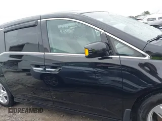 2012 Honda Odyssey Touring with VIN 5FNRL5H96CB058828, listed as a IAAI auction lot 41731389 with 152,295 mi miles and . Bid and sale history available at DreamBid. Image 13.