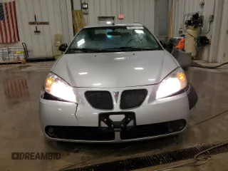 2009 Pontiac G6 1SA z VIN 1G2ZG57B294112235, wystawiony jako Copart lot #86734174 z przebiegiem 111 612 mil mil oraz Nie do naprawy. Historia ofert i sprzedaży dostępna na DreamBid. Obrazek 5.