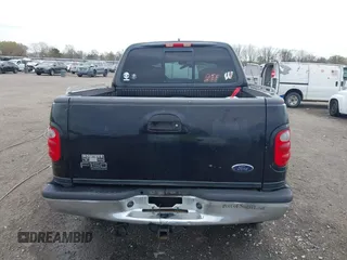 2002 Ford F-150 XLT with VIN 1FTRW08L32KD90202, listed as a IAAI auction lot 41850546 with 256,807 mi miles. Bid and sale history available at carsss.com. Image 19.