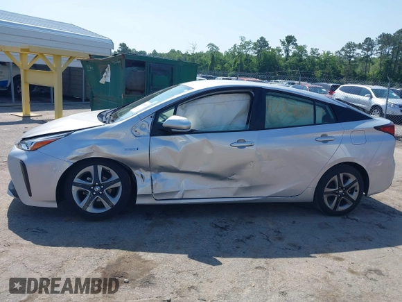 2021 Toyota Prius L Eco z VIN JTDKAMFU5M3137298, wystawiony jako IAAI lot #42270937 z przebiegiem 38 828 mil mil oraz . Historia ofert i sprzedaży dostępna na DreamBid. Obrazek 13.