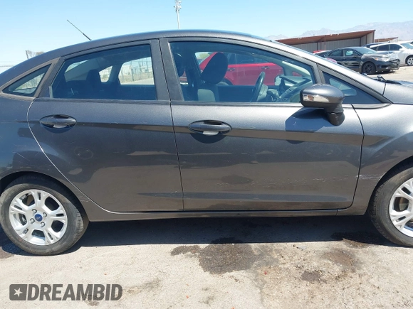 2015 Ford Fiesta SE with VIN 3FADP4BJ1FM217045, listed as a IAAI auction lot 42120444 with 119,207 mi miles and . Bid and sale history available at DreamBid. Image 14.