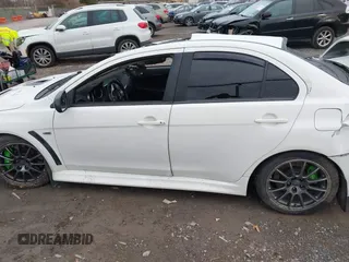 2014 Mitsubishi Lancer Evolution GSR with VIN JA32W8FV5EU012572, listed as a IAAI auction lot 40871463 with 89,529 mi miles. Bid and sale history available at carsss.com. Image 15.