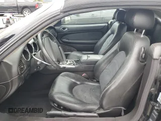 2006 Jaguar XK with VIN SAJDA42C462A44968, listed as a Copart auction lot 75758524 with 77,266 mi miles and Salvage Title. Bid and sale history available at carsss.com. Image 7.