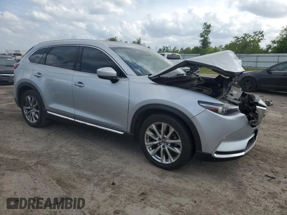 2016 Mazda CX-9 Signature with VIN JM3TCBEY1G0121667, listed as a Copart auction lot 54974805 with Not provided miles and Salvage title. Bid and sale history available at DreamBid. Image 4.