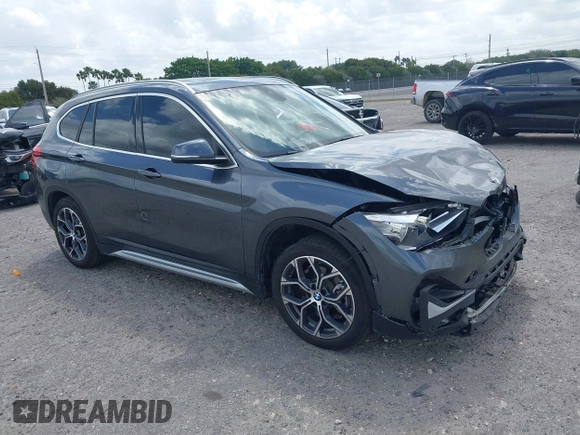 2022 BMW X1 sDrive28i with VIN WBXJG7C00N5U59675, listed as a IAAI auction lot 41915231 with 34,983 mi miles. Bid and sale history available at carsss.com. Image 1.
