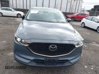 2021 Mazda CX-5 Touring with VIN JM3KFBCM5M0483547, listed as a IAAI auction lot 41683694 with 55,791 mi miles. Bid and sale history available at carsss.com. Image 12.