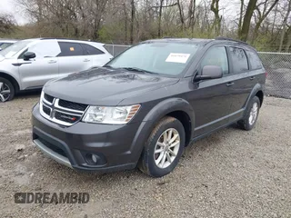 2016 Dodge Journey SXT with VIN 3C4PDCBG9GT137742, listed as a IAAI auction lot 41879431 with 207,443 mi miles. Bid and sale history available at carsss.com. Image 2.