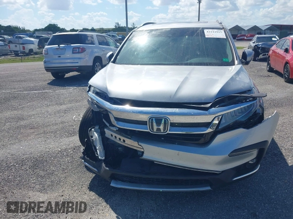 2021 Honda Pilot Touring 8-Passenger with VIN 5FNYF5H99MB041638, listed as a IAAI auction lot 42112915 with 33,230 mi miles and . Bid and sale history available at DreamBid. Image 12.