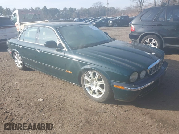 2004 Jaguar XJ with VIN SAJWA71C74SG22814, listed as a IAAI auction lot 41649399 with 114,841 mi miles. Bid and sale history available at carsss.com. Image 1.