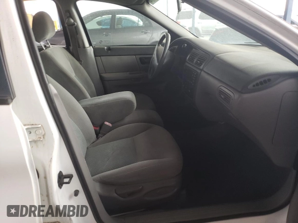 2003 Ford Taurus LX Standard with VIN 1FAFP52U53G280700, listed as a Copart auction lot 87488014 with 128,020 mi miles and Salvage title. Bid and sale history available at DreamBid. Image 7.