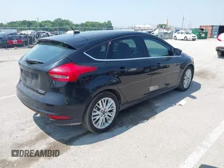 2015 Ford Focus Titanium z VIN 1FADP3N27FL219978, wystawiony jako IAAI lot #42433005 z przebiegiem 175 459 mil mil oraz . Historia ofert i sprzedaży dostępna na DreamBid. Obrazek 4.